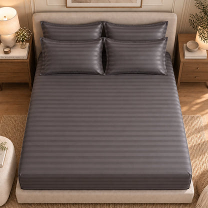 Charcoal bedsheet styled on a bed
