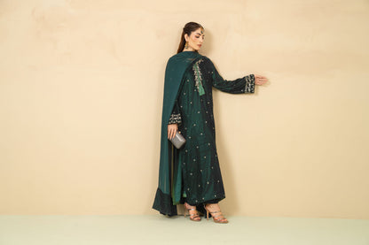 Model wearing Laila bottle green velvet three piece