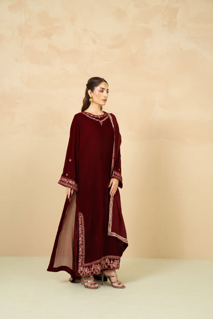 Model wearing Gul-e-Rana maroon velvet suit
