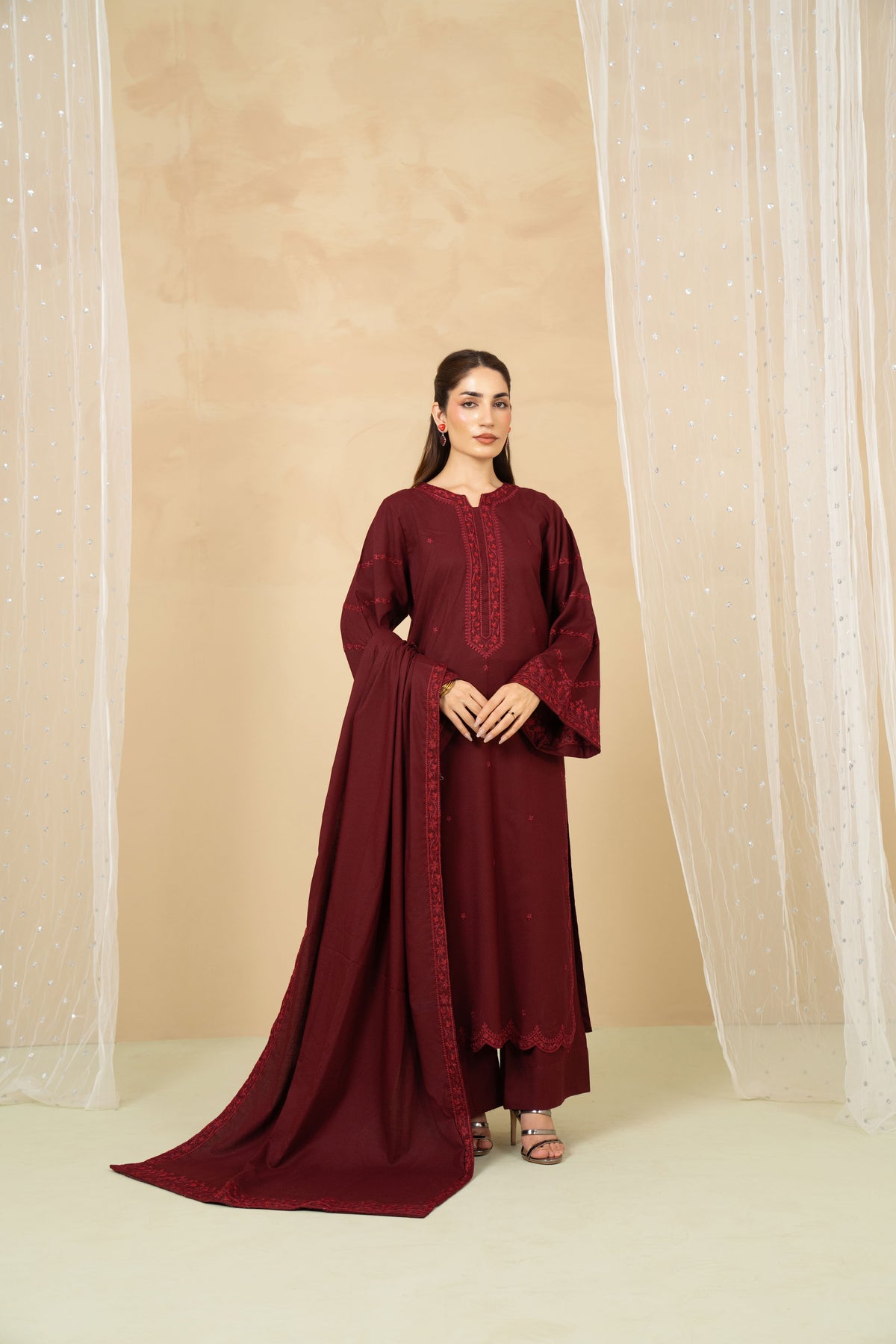 Model wearing Crimson maroon embroidered long shirt