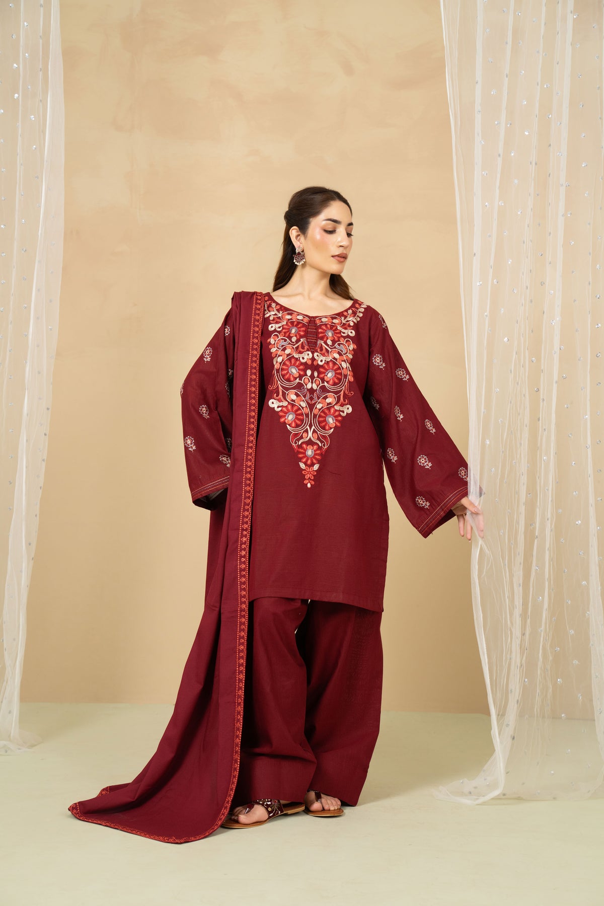 Model wearing Garnet maroon farshi shalwar suit