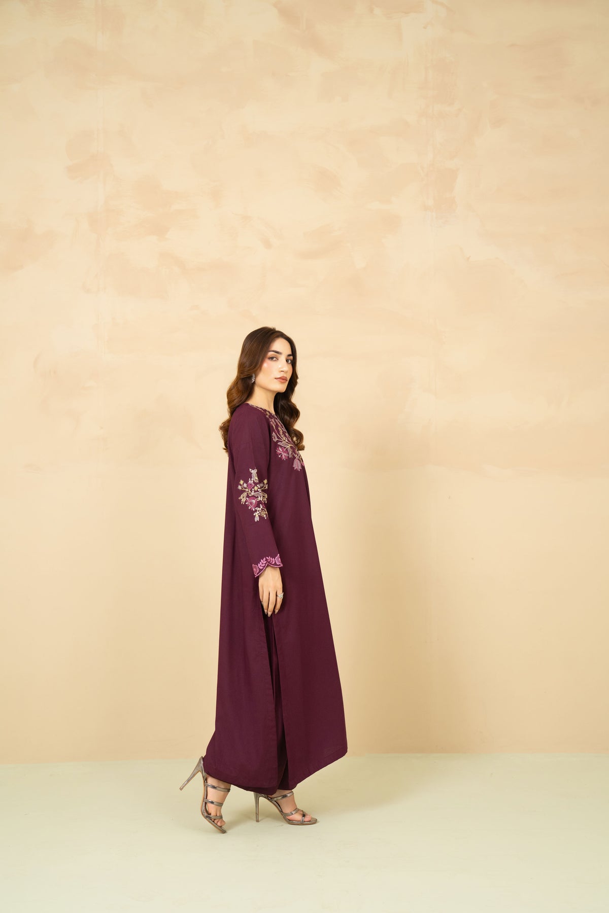 Model wearing Mulberry plum A-line suit