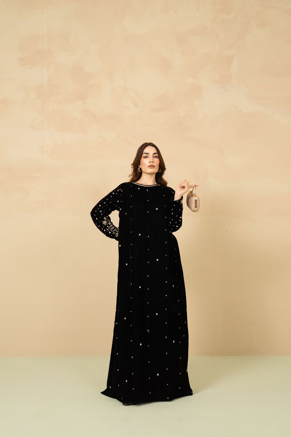 Model wearing Shabnam black velvet kaftan