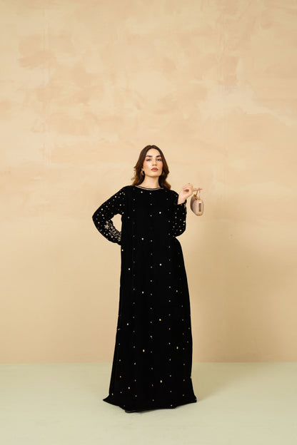Model wearing Shabnam black velvet kaftan
