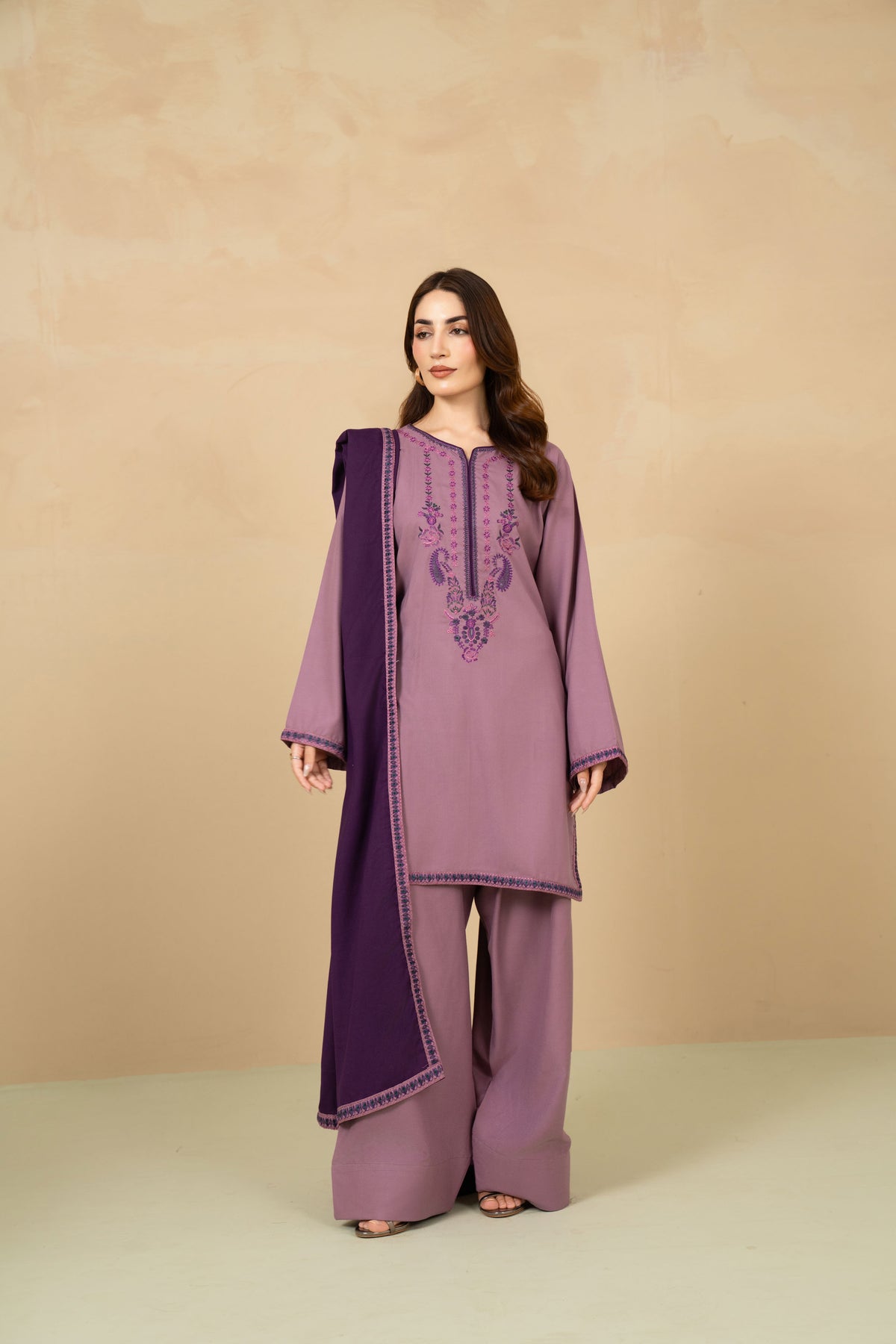 Model wearing Lavender lilac farshi shalwar suit