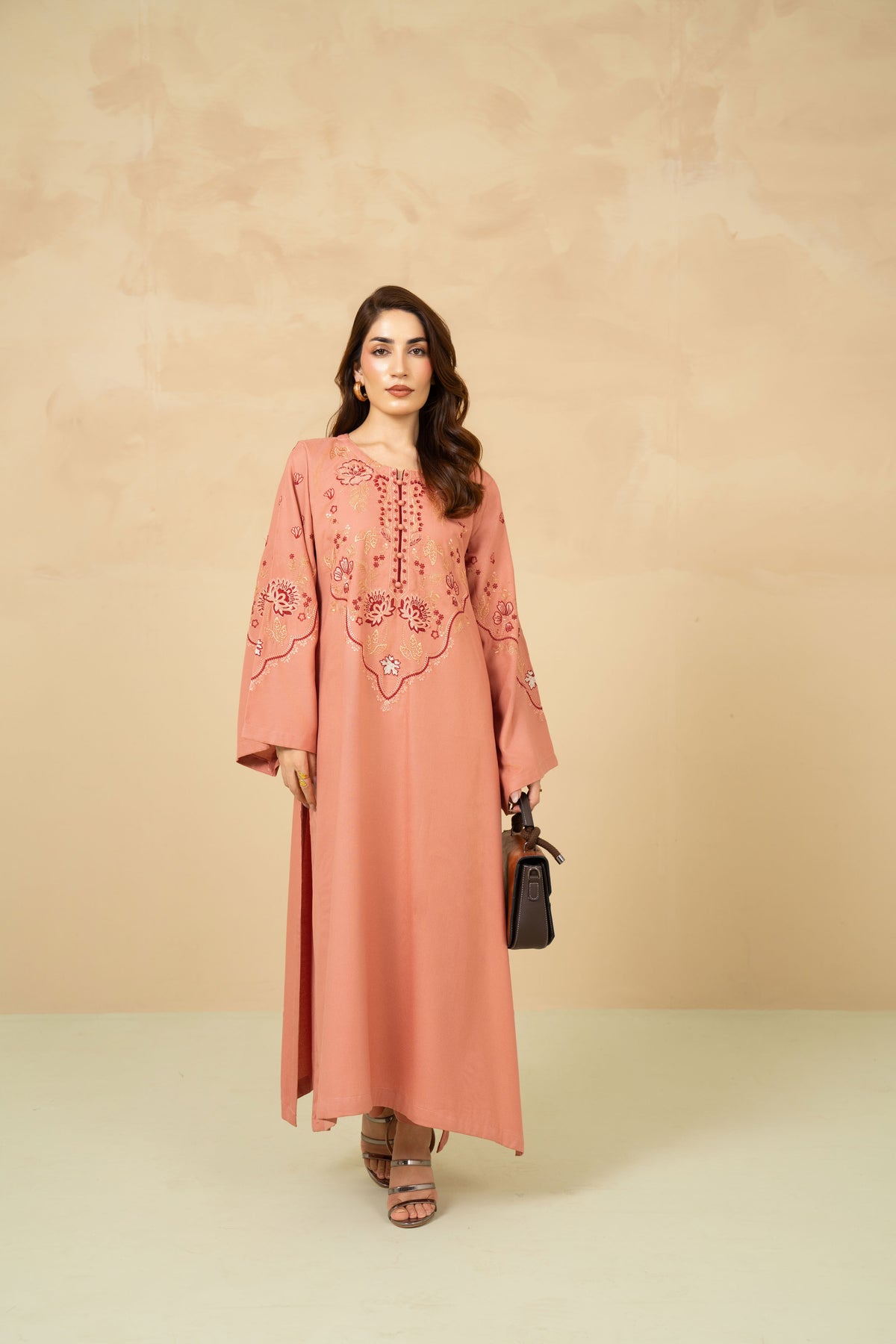 Model wearing Blush Tea tea pink A-line suit