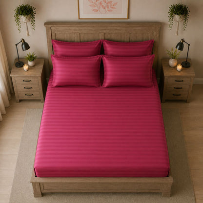 Pink bedsheet styled on a bed