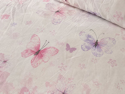 Butterfly print detail on blush bedsheet