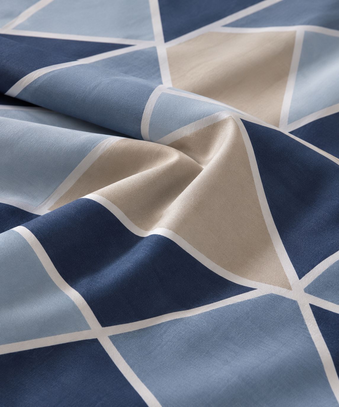 Blue prism print detail on bedsheet