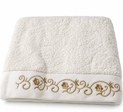 White and gold towel folded, cotton terry