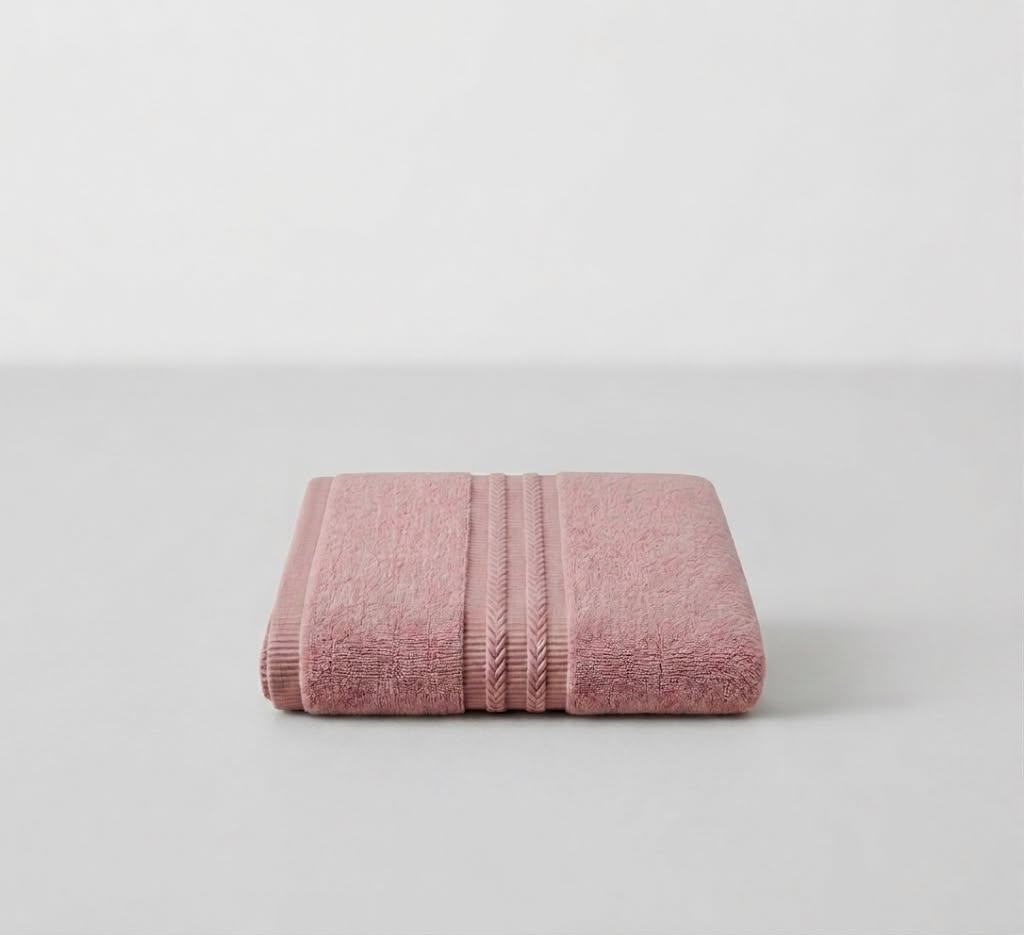 Tea pink bath towel by Tiraz Homes