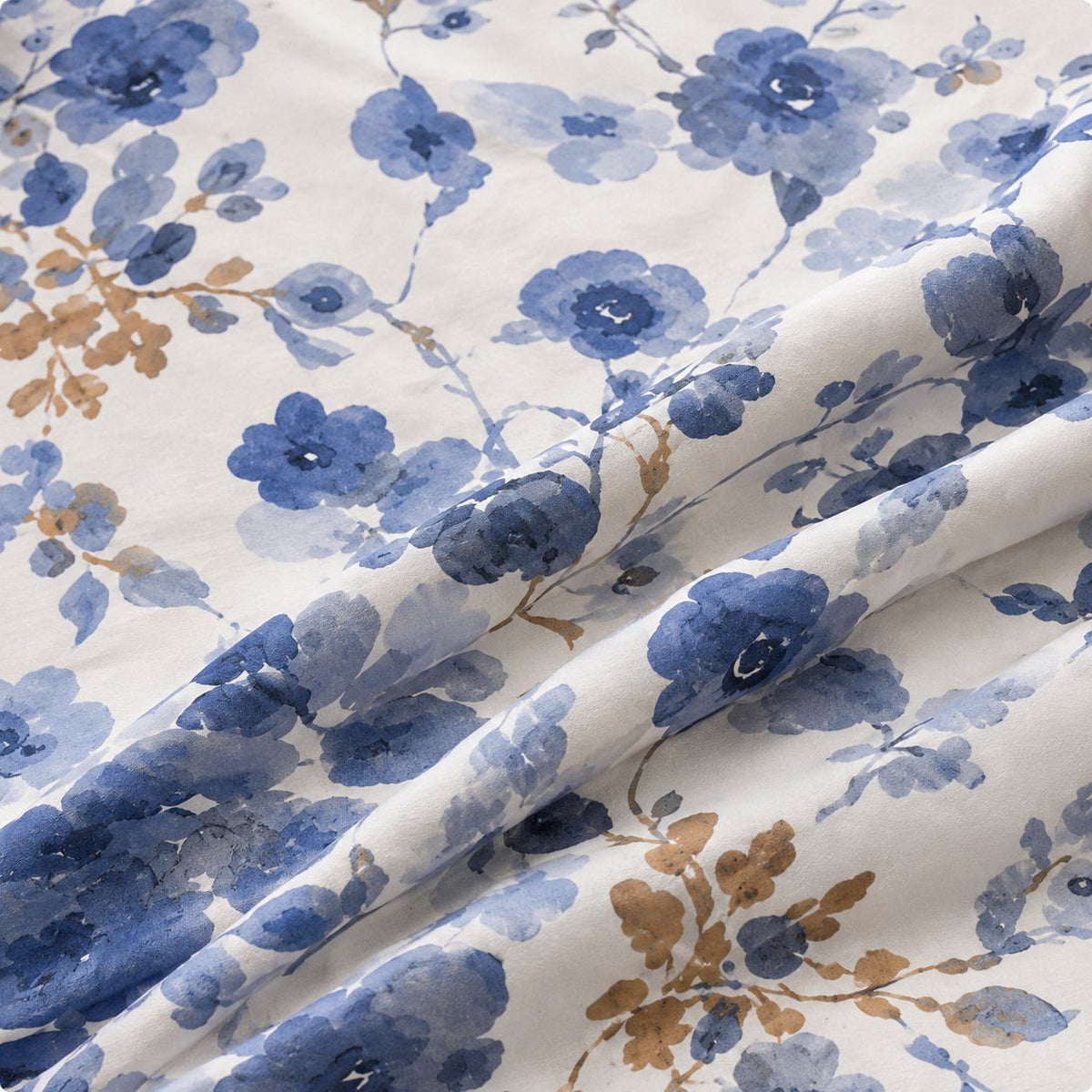 Lilac bloom print detail on bedsheet