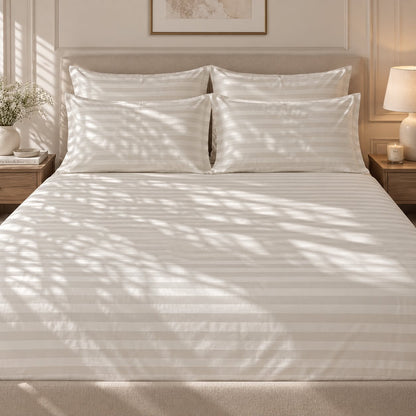 Ivory bedsheet styled on a bed